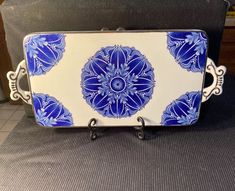 a blue and white tray sitting on top of a chair