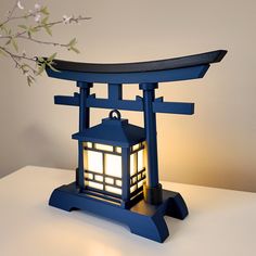 a blue lantern sitting on top of a white table