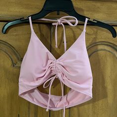 80% Nylon 20% Spandex Pink Stretch Halter Top For Swimming, Trendy Pink Halter Top For Beach, Seamless Swimwear For Spring Party, Seamless Party Swimwear For Spring, Pink Fitted Halter Top For Beach Party, Fitted Pink Halter Top For Beach Party, Pink Halter Top For Swimming In Spring, Pink Halter Top For Pool And Spring Season, Spring Seamless Halter Top For Swimming