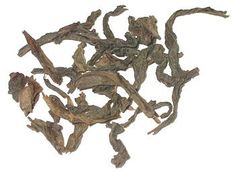 a pile of dried tea leaves on a white background