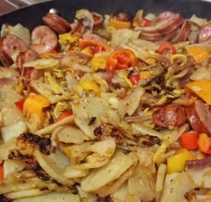 a skillet filled with lots of food on top of a stove