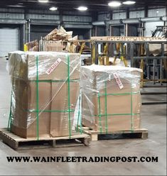 boxes are stacked on pallets in a warehouse