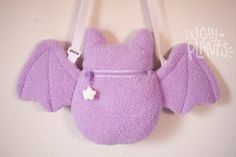 BOO! wHAT, you're saying I DIDN'T scare you??? You say my face is too cute!??! This bat plush purse is ready to accompany you on your adventures this spooky season! When is spooky season you ask? It's now! It's all the time!!!! 10" tall (from ear to booty) 18" wide (wing to wing). Straps max out at 50" and are adjustable- making these perfect for humans of all shapes and sizes! Kids, adults, you name it. Zipper opening is approx. 5.5 inches Interior depth of the pouch is approx. 5.5 inches. Just Bat Plush, Pastel Goth Fashion, Spooky Cute, Cute Bat, Plush Bags, Novelty Bags, Cute Plush, Galaxy Note 10, Cute Bags