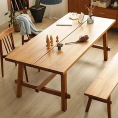 a wooden table and bench in a room