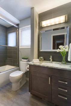 a bathroom with a sink, toilet and bathtub