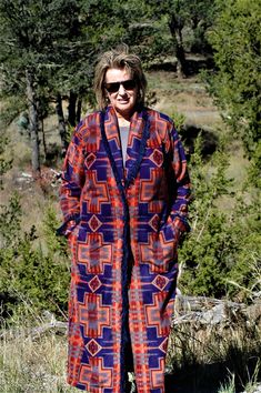 "Womens Indian blanket coat, in a southwestern shawl collar velour anti-pill fleece. Easy travel coat. Light on but will keep you warm and cozy. This a coat that will get you noticed and get you complements and is more or less time less. Makes a great gift for yourself or that some special.   READY TO SHIP 1: Shawl collar 2: Slightly drop shoulder easy fit 3: Side seam pockets (sewn down to lay flat over hips) 4: 2 1/2\" cuff with 1 1/4\" double V faux leather fringe in navy 5: 1 1/4\" double V faux leather fringe in navy going down the front of the coat around the collar and the to the waist on the inside.  6: Center back seam makes easy for any alterations  7: Shoulder pads for structure and will mold to your body when worn 8: Wide facings, and at the bottom of the coat they add weight, Travel Coat, Indian Blankets, Full Length Coat, Luxury Winter, Blanket Coat, Black And White Shorts, Woven Jacket, Cruise Wear, Easy Travel