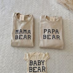 three baby onesuits with the words mama bear and papa bear printed on them