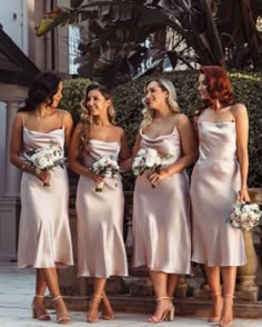 the bridesmaids are all dressed in pink dresses