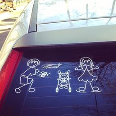 stickers on the back window of a car that has been drawn with children's drawings