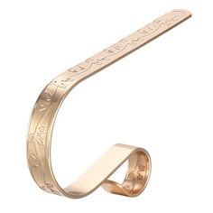 a gold bracelet with an inscription on the side and a ring in the shape of a letter