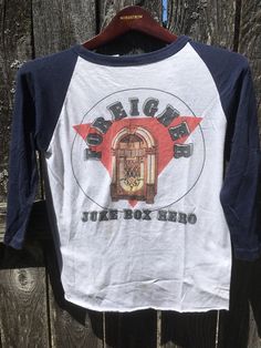 Super rare vintage Foreigner 4 concert t-shirt. Purchased at The Carrier Dome in Syracuse , NY Fabric:50/50 Brand: Size:Medium Pit to Pit: 16" Length:22" Vintage Crew Neck T-shirt For Concert, Vintage T-shirt For Concerts, Retro White Top With Band Logo, Retro White Tops With Band Logo, Retro Band Logo Tops, Retro Pre-shrunk Tops For Concerts, Vintage Crew Neck Tops For Concerts, Vintage White Top With Band Logo, Vintage Pre-shrunk T-shirt For Concert