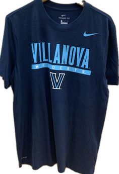 a t - shirt that says villanovaa on the front and blue letters on the back