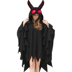 a woman wearing a black cape with red eyes and horns on her head, standing in front of a white background