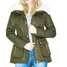 A Luxe Take On The Military Trend, This Nylon-Blend Coat Belongs In Your Cold-Weather Wardrobe. The Faux-Shearling Collar Keeps You Warm While Gold-Tone Hardware Adds A Glamorous Finishing Touch. Nylon-Blend Coat. Oversized Pointed Collar With Contrast Faux-Shearling Lining. Long Sleeves. Four Front Flap Pockets Plus Two Zipper Pockets. Cinched Waist With Interior Drawstring. Lace-Up Detail At Lower Back. Front Zipper Plus Snap-Button Closures. Quilted Lining. Shell: 77% Polyester, 23% Nylon. Li Spring Fur Coat For Cold Weather With Pockets, Cold Weather Spring Fur Coat With Pockets, Trendy Fur Coat With Pockets For Cold Weather, Fur Coat With Pockets For Cold Weather In Spring, Winter Faux Fur Outerwear With Pockets, Faux Fur Parka For Cold Weather In Fall, Fall Parka With Faux Fur Trim And Long Sleeves, Fall Parka With Faux Fur Trim, Fall Faux Fur Outerwear With Pockets