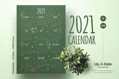 a green calendar is next to a potted plant