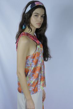 A carefully patterned and constructed top in pink, orange, and blue coloring. Designed to drape dramatically around the body, but still centered on simplicity. Can be styled up or down based on accessories. Composition: 93% Silk, 7% Polyester Multicolor Digital Print Traditional Drape Dress, Multicolor Print Long Sleeve Silk Top, Draped Top, Womens History Month, Fashion Event, Women In History, Color Rosa, Pink Print, Pink Orange