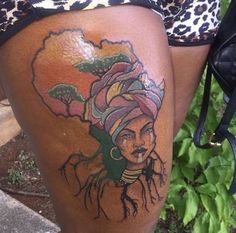 a woman with a tattoo on her thigh