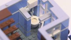 a close up view of a lego model of a building with a toilet in it