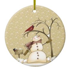 a christmas ornament with a snowman and bird