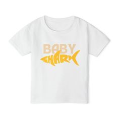 This Baby Shark Toddler T-shirt is perfect for little ones who love the catchy tune. The vibrant design brings a fun and playful vibe to any outfit, making it a great choice for everyday wear or special occasions. Ideal for parents looking to add a touch of whimsy to their child's wardrobe. Product features - 100% cotton composition for comfort - Twill tape neck and shoulder seams for durability - Side seams for added structure and shape retention - 1x1 Ribbed collar for a well-fitted tee - Heavy fabric for lasting quality Care instructions - Machine wash: cold (max 30C or 90F) - Non-chlorine: bleach as needed - Tumble dry: low heat - Iron, steam or dry: low heat - Do not dry clean Baby Shark Shirt, Shark Shirt, Fitted Tee, Outfit Making, Baby Shark, Vibrant Design, Kid Tees, Twill Tape, Workout Tee