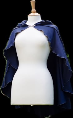 ~ Midnight Blue Driud Lily Capelet ~ The Druid Lily Capelet is made from lovely stretchy cotton jersey with vertical striped detail, lettuce-edging & large pixie hood. It has a Norwegian Clasps fastening at the throat in either silver or gold - please let me know which colour you would like when placing your order :) The colours of the capelet in the photos are midnight blue material with silver grey gold thread detail. Perfect for Fanciful Faeries, Gothic Goddesses & Pixchievious Pixies Blue Cloak Aesthetic, Blue Goth Outfits, Blue Grey Outfit, Acedamia Outfits, Blue Cloak, Royalty Clothing, Ren Faire Outfits, Blue Cape, Wheel Of Time