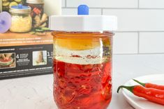 a jar filled with food sitting on top of a table