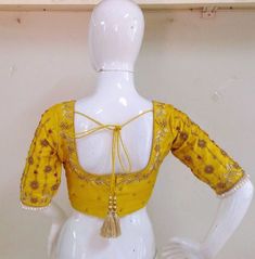 Pure raw silk blouse with maggam work on neck sleeves and back neck. Custom fitted. -Measurements sheet will be sent to you once you order( Standard sizing also available) -Custom colors available -Work on front back and sleeves. Bollywood Style Yellow Tops For Festivals, Designer Yellow Blouse With Resham Embroidery, Yellow Blouse With Resham Embroidery For Navratri, Yellow Resham Embroidery Blouse For Navratri, Yellow Blouse With Zari Work For Navratri, Yellow Resham Embroidered Top For Wedding, Navratri Yellow Blouse With Resham Embroidery, Yellow Zari Work Top For Navratri, Festive Yellow Blouse With Resham Embroidery