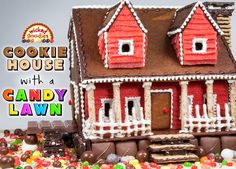 there is a cake that looks like a house with candy in front of it and the words, cookie house with a candy lawn