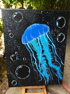 a painting of a blue jellyfish with bubbles on it