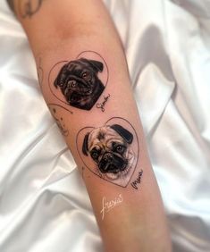 a couple of pug tattoos on the arm