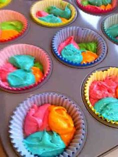 cupcake tins filled with different colored frosting