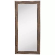 a large wooden mirror hanging on the wall