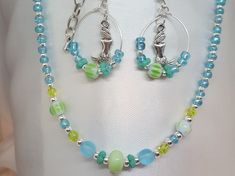 "Blue Beaded Necklace *FREE SHIPPING*/Silver Jewelry Unique Silver, Blue, Sea foam Green, Choker with Czech Glass Beads. This beach inspired Choker are sure to be a hit this summer with you or as a great thoughtful gift! The choker will fit necks from 13\" inches up to 16\" inches. Length of the choker 13\" to 15\" inches, allowing chain dangle on end, depending on where you hook the clasp on the extension chain. Hypoallergenic to eliminate irritation/ Excellent customer reviews/Handmade in the Blue Jewelry With Silver Beads For Summer, Handmade Blue Jewelry For Beach Season, Ocean-inspired Beaded Necklaces For Summer Gift, Blue Jewelry With Silver Beads For The Beach, Summer Silver Jewelry With Colorful Beads, Blue Jewelry With Lobster Clasp For Summer, Handmade Silver Beaded Necklace For Beach, Silver Handmade Beaded Necklace For Beach, Turquoise Jewelry With Spacer Beads For Summer