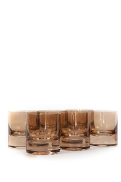 four glasses sitting on top of each other