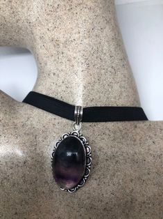 Genuine Amethyst Necklace Low content Silver with a Rhodium finish NOT 925 Hangs on a black velvet ribbon Can adjust around the neck Can be hung on silver chain Large Cabochon Amethyst All jewelry is shipped free in the US in a nice gift box. Check out our over a THOUSAND great reviews Black Amethyst Jewelry For Formal Occasions, Elegant Black Amethyst Necklace, Formal Black Amethyst Jewelry, Black Sterling Silver Choker For Gift, Black Sterling Silver Choker As Gift, Elegant Black Amethyst Jewelry, Black Velvet Ribbon, Bib Necklaces, Vintage Purple