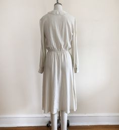 "Long-sleeved, ivory dress with pintucks and embroidered lace collar, from the 1980s. Bust measures 19\" (48.5 cm) flat across and waist measures 12-17.5\" (30.5-44.5 cm) flat across. The dress is 45\" (114 cm) in length. Original size is an 11. Cotton blend." Dark Blue Dress, Ivory Dress, 1980s Dresses, Ivory Dresses, Cotton Maxi, Maxi Dress Cotton, Lace Collar, The 1980s, Philadelphia Pa