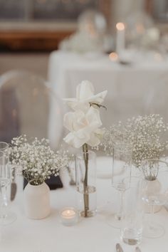 Serene White Floral Arrangements for Timeless Table Decor Wedding Round Table Decorations, Romantic Candlelit Wedding, Round Wedding Tables, Wedding Neutral, Candlelit Wedding, Birthday Cards For Girlfriend, Round Table Decor, White Floral Arrangements, Wedding Centrepieces