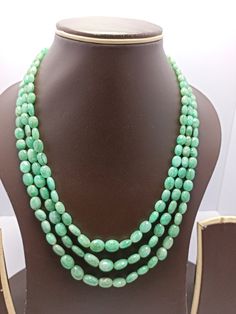 Awesome 314 Carat Fine Quality Natural  Emerald  Smooth Oval Gemstone Necklace Adjustable code Stone  :Natural  Emerald Shape :-  oval Necklace - 18 inch 3 line string Size :- 4x5mm to 9x11mm Weight :- 314 carat Polish :- Handmade Purity :- 100% Natural Gemstone Purity :- AAA color - green makes a great gift for your loved ones. It is known as the 'love stone' as the message it emits is the strong vibration of unconditional love, joy, warmth and healing. As quartz crystals are profound amplifiers of energy, it may help to kindle happiness, love, romantic feelings and sensuality. It is good for people in public dealing  Click below to see live stock:  https://www.etsy.com/au/shop/ShakugemsStore?ref=search_shop_redirect If for any reason you are not satisfied with your purchase. You can retu Oval Emerald Gemstone Beads Necklace Gift, Green Oval Gemstone Beads Necklace, Green Oval Gemstone Bead Necklace, Oval Green Gemstone Beaded Necklaces, Handmade Oval Emerald Necklace, Oval Necklace, Quartz Crystals, Natural Emerald, Beads Necklace