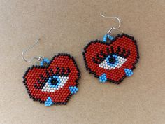 Red hearts with blue eyes and blue teardrops. They are 1.5 inches long, not including the hooks, and 1.75 inches wide. Halloween Earrings Beaded, Heart Beaded Earrings, Beaded Earrings Native, Earrings Patterns, Beaded Jewlery, Beaded Earrings Patterns, Earrings Beaded, Halloween Earrings, Red Hearts