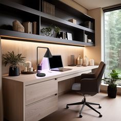 a desk with a computer on it in front of a window and some bookshelves