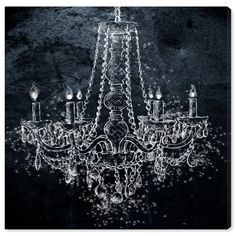 a chandelier with candles lit up in black and white photo art print on canvas