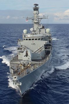 a large white ship in the middle of the ocean