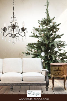 a living room with a couch and a christmas tree