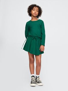 Soft cotton-blend shirt and skort set.  Crewneck.  Long sleeves.  Elasticized waist with drawcords.  Flutter skirt.  Inner shorts.  Straight, easy fit.  Hits at the hip.  Easy pull-on waist.  Easy through the hip and thigh. Rompers For Girls, Skort Set, Skort Outfit, Gap Kids, Girls Rompers, Outfit Set, Gap, Girl Fashion