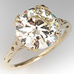 an oval cut diamond in a yellow gold ring