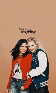 two young women standing next to each other in front of a wall with the words, you're my everything