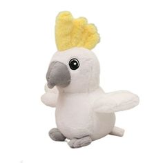 a white stuffed bird with a yellow crown on its head and wings, standing upright