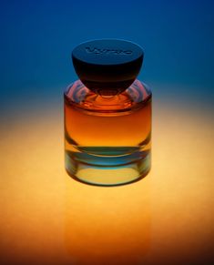 an empty glass bottle sitting on top of a table