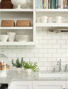 the kitchen is clean and ready to be used for cooking or baking, but it's not too crowded