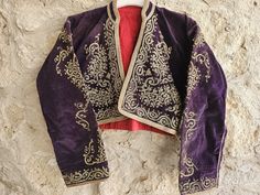 Antique Turkish Jacket,Golden glitter Embroidery,Purple Velvet, Antique Ottoman Embroidered Velvet Waistcoat!1468 a very rare masterpiece, Anatolian velvet jacket circa 1850. Size:40x40 cm & 15x15 inchew Size:S/M (for more details, don't hesitate to contact me) Material: textile product is 100% velvet, Gold embroidery . Washing instructions: hand wash, cold wate Condition : good condition. **In addition, bulk purchases and interior designer and home decoration and special discounts are made. Ple Embroidered Long Sleeve Outerwear For Costume, Embroidered Long Sleeve Purple Outerwear, Embroidered Purple Long Sleeve Outerwear, Purple Embroidered Long Sleeve Outerwear, Purple Long Sleeve Embroidered Outerwear, Glitter Embroidery, Velvet Waistcoat, Antique Ottoman, Embroidered Velvet